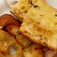 Fresh Garlic Bread · Authentic Italian bread with homemade garlic and butter sauce.