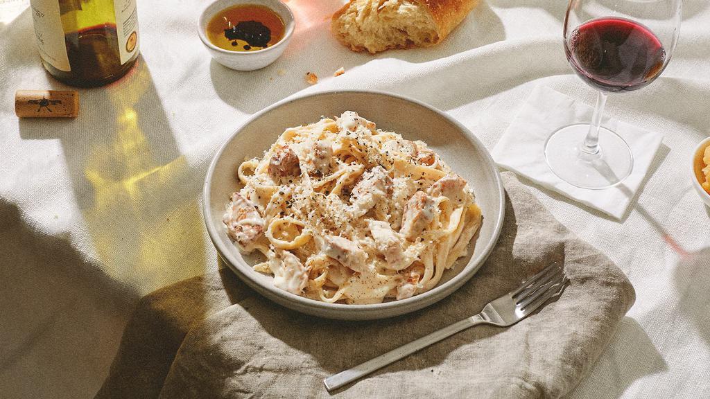Fettuccine Alfredo · Fettuccine in rich and creamy Alfredo sauce topped with fresh Parmesan cheese.