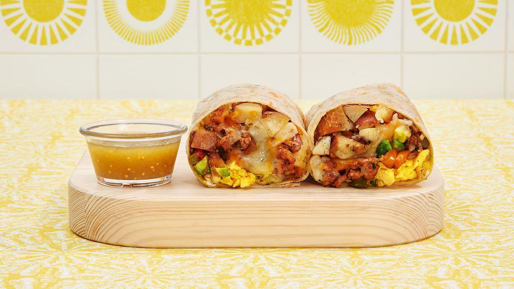Build Your Own Burrito · Two scrambled eggs with your choice of meat and toppings wrapped in a fresh tortilla.