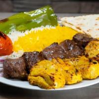 Chicken & Beef Kabob Combo Plate · Marinated boneless chicken thigh and marinated chunks of flap meat served with rice or salad...