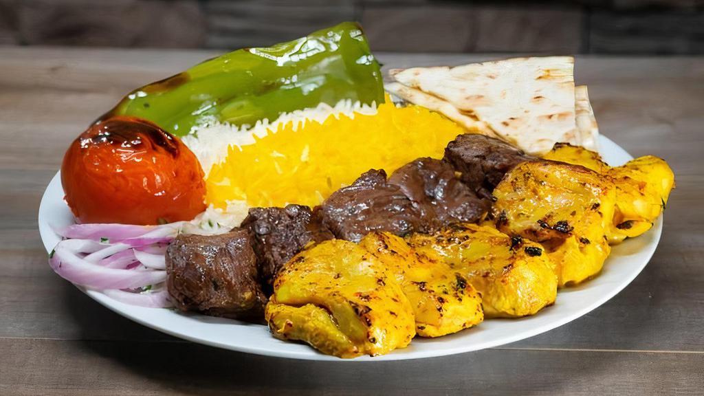 Chicken & Beef Kabob Combo Plate · Marinated boneless chicken thigh and marinated chunks of flap meat served with rice or salad and choice of 1 side and bread.
