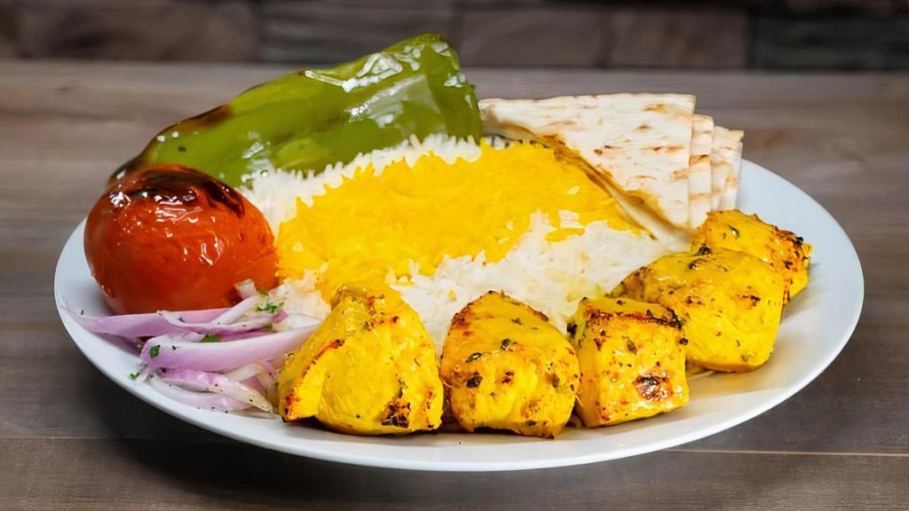 Spicy Chicken Breast Kabob Plate · Marinated spicy chicken breast kabob, skewered and charbroiled to perfection served with rice or salad and choice of 1 side and bread.
