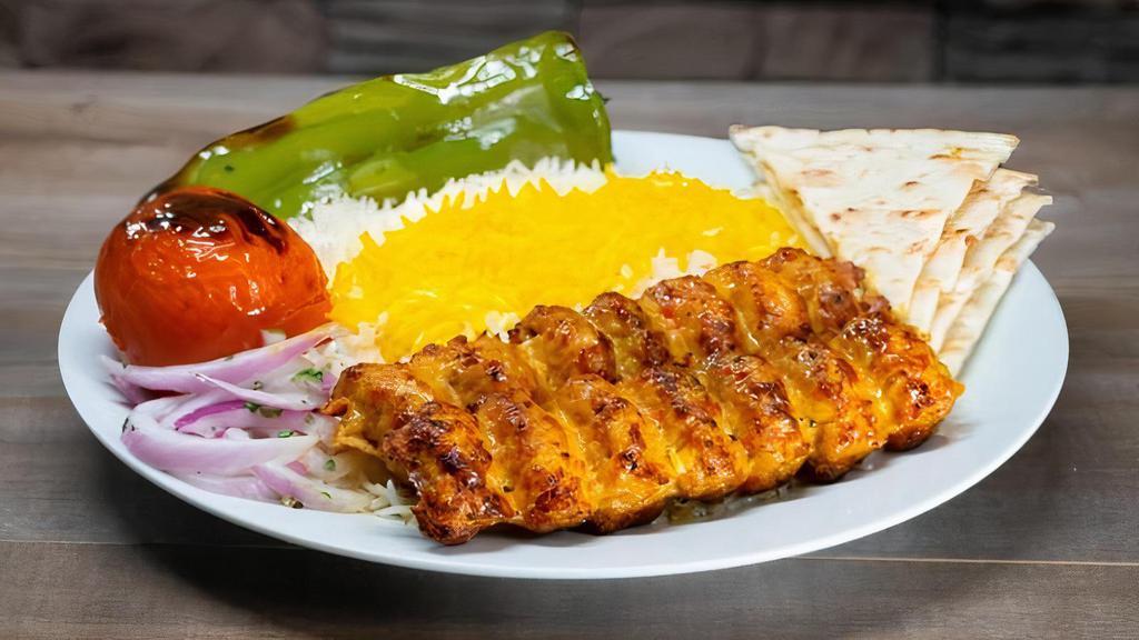 Chicken Luleh Kabob Plate · Ground (thigh & breast) of chicken mixed with special spices, skewered and charbroiled to perfection served with rice or salad and choice of 1 side and bread.