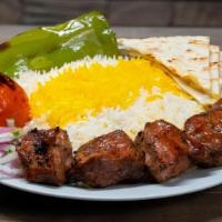 Pork Kabob Plate · Marinated boneless pork shoulder (butt) kabob, skewered and charbroiled to perfection served...