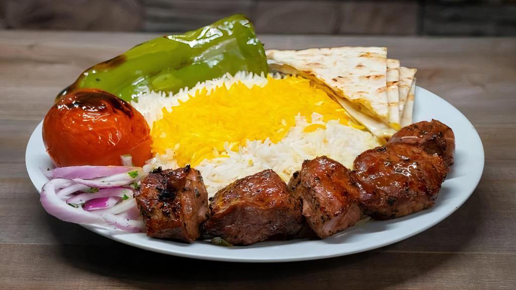 Pork Kabob Plate · Marinated boneless pork shoulder (butt) kabob, skewered and charbroiled to perfection served with rice or salad and choice of 1 side and bread.
