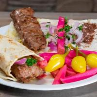 Lamb Kabob Wrap · Marinated chunks of of boneless lamb in a wrap served with 1 side.