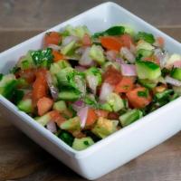 Shirazi Salad · Diced tomato, cucumber, red onion, parsley topped with our special house dressing.