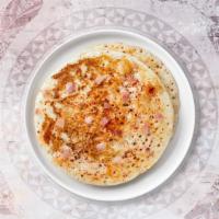 Uthappam · A fluffy Indian pancake made with rice and lentil batter.