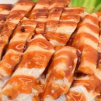 Chicken Teriyaki · Marinated grilled chicken breast topped with teriyaki sauce served with steamed rice, steame...