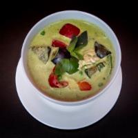 Green Curry · Simmered in green curry sauce and coconut milk, sliced bamboo shoots, baby corn, eggplant, b...