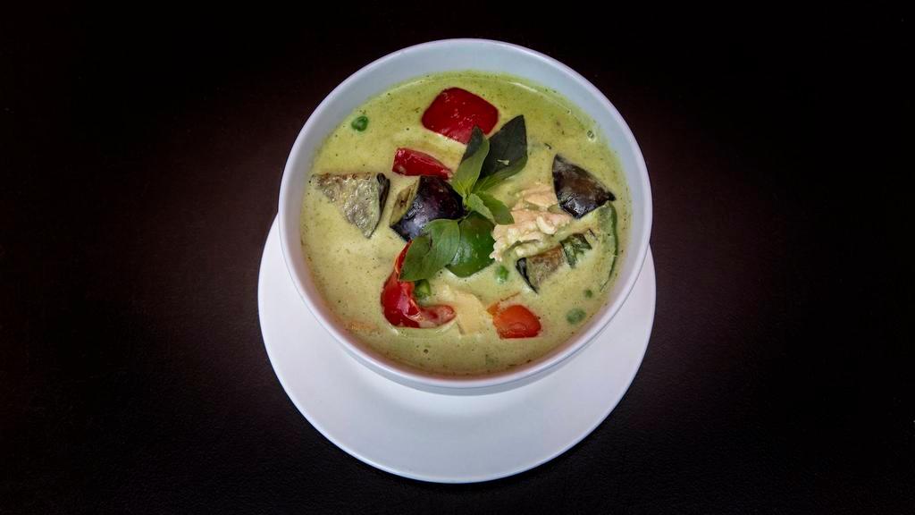 Green Curry · Simmered in green curry sauce and coconut milk, sliced bamboo shoots, baby corn, eggplant, bell peppers, sweet peas, and thai basils.