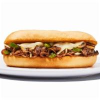Philly Cheese Steak Sandwich · topped with sautéed onions, green peppers, mushrooms and provolone cheese and served on a ho...