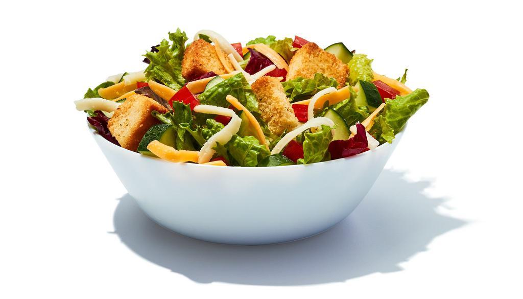 Side Garden Salad · Spring mix greens piled with diced tomatoes, crisp cucumbers, cheddar cheese, monterey jack cheese and croutons and your choice of salad dressing. 160 cal.