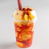 Mangonada Mediana / Medium Mangonada · Mango Ice cream served in a cup with chamoy and tajin, with pieces of natural mango on top w...