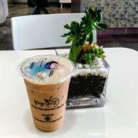 Okinawa Milk Tea · House special black tea with milk, comes with boba, custard pudding and rainbow jelly.