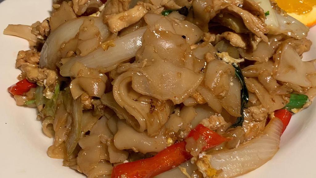 Drunken Noodles · Stir fried flat rice noodles, egg, green bean, onion, cabbage, bell pepper, basil with spicy garlic sauce.