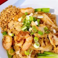 Pad Thai · Rice noodles, egg, bean sprout and green onion pan fried in a tangy sauce. Crushed peanut.