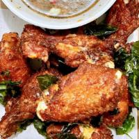 Thai Exotic Wings · Crispy chicken wings with spicy chili garlic sauce.