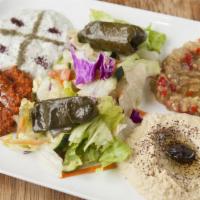 Veggie Plate · Combination of hummus, cacik (tzatziki), ezme, dolma, eggplant dip and salad blended with vi...