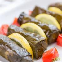 Dolma · Five grape leaves stuffed with rice, spices and extra virgin olive oil.