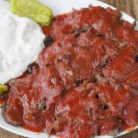 Iskender · Crunchy tandoor pita bread topped with thinly sliced doner, topped with our homemade tomato ...