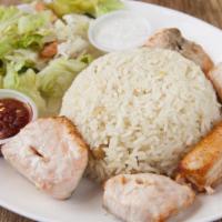 Salmon Kebob · Grilled salmon skewers marinated in our special sauce. Served with rice, salad, garlic sauce...
