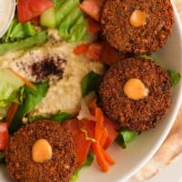 Falafel Bowl · 5 pieces of our freshly made falafel served with hummus, green salad, pita bread and side of...