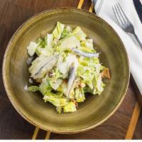 Cesare (Caesar Salad) · Romaine hearts tossed with home baked croutons, white anchovy, Parmigiano-Reggiano and class...