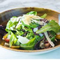 Tricolore (Tricolor Salad) · Mixed green salad tossed with cherry tomatoes in a balsamic dressing and served with shaved ...