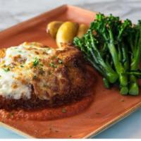 Pollo Alla Parmigiana (Chicken Parmesan) · Lightly pounded chicken breast, breaded, and fried, served with broccolini and potatoes.