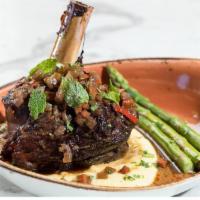 Ossobuco Di Agnello (Braised Lamb Shank) · Slow oven braised lamb shank served with rich and creamy polenta and asparagus.