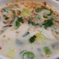 Tom Kha · Lemongrass, lime and coconut milk based soup with cabbage, mushroom, cilantro, and green oni...