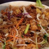 Pad Thai · Stir-fried rice noodle with tofu, eggs, bean sprouts, green onions topped with
ground peanut.