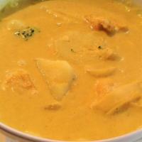 Yellow Curry · Yellow curry paste in coconut milk with potatoes and onions.