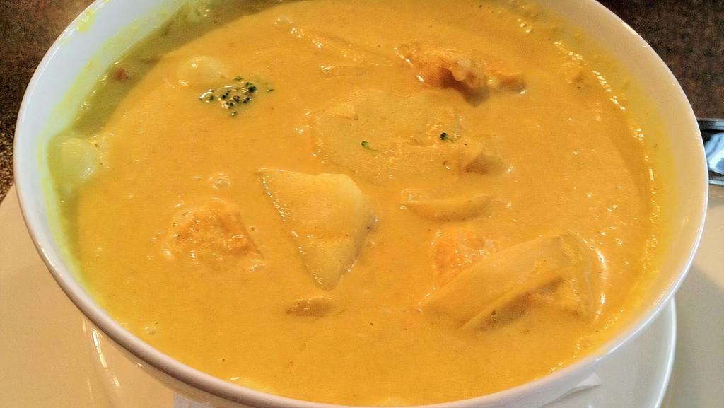 Yellow Curry · Yellow curry paste in coconut milk with potatoes and onions.
