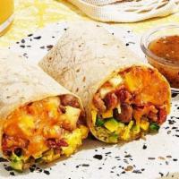 Build Your Own Burrito · Two scrambled eggs with your choice of meat and toppings wrapped in a fresh tortilla.
