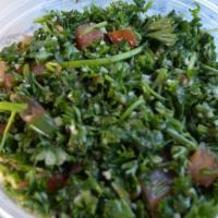 Tabbouleh Salad · Cracked wheat, fresh parsley, tomatoes, green onions, lemon juice and olive oil.