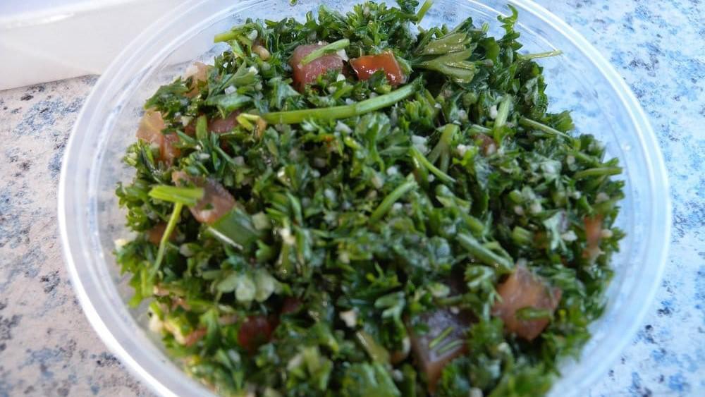 Tabbouleh Salad · Cracked wheat, fresh parsley, tomatoes, green onions, lemon juice and olive oil.