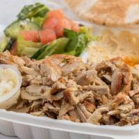 Chicken Shawerma · Slices of flame broiled chicken, marinated with lemon, garlic, spices, served with rice, hum...