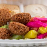 Falafel · Four pieces of falafel; a zesty mixture of special spices, beans, fresh onions, and garlic. ...
