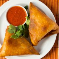 Sambussa · Pastry shell filled with choice of either lentils and green peppers spiced with cumin and gr...
