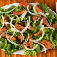 Green Salad (Ethiopian Style) · Green salad, tomatoes, and onions with dressing.