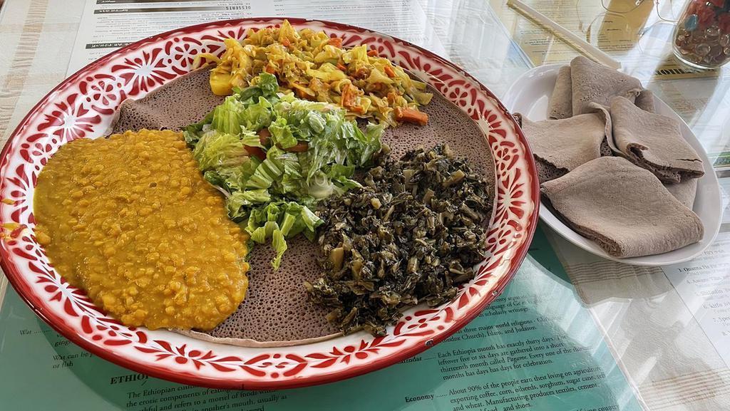 Vegetables Alcha · Vegetarian Steamed vegetables (cabbage, potato, carrot, and onion). Seasoned with assorted spices. Served with fresh salad and injera.