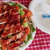 Grilled Chicken Breast Salad. · Dinner salad with lettuce, tomatoes, carrots, onions, celery, and pickles topped with a 7-8o...