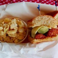 Polish Sandwich · Two charbroiled polish sausage links topped with a pickle spear, swiss cheese and spicy must...