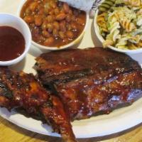 Combo Dinner · 1/4 charbroiled chicken matched with 1/3 slab of baby back ribs.. Served with a fresh-baked ...