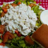 Chicken Salad Salad. · A healthy portion of delicious chunks of chicken breast and spices with a hint of honey serv...