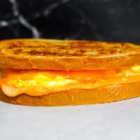 Sourdough, Egg, & Cheddar · 2 scrambled eggs, melted Cheddar cheese, and Sriracha aioli on buttery toasted sourdough.