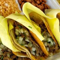 Birria Tacos Combo · Four soft birria tacos, rice and beans, 14 oz consome (No meat), condiments on the side.