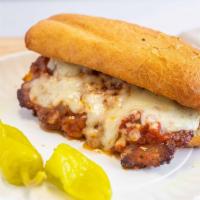 6'' Italian Sausage Sandwich · Served with marinara sauce, topped with Mozzarella and Parmesan cheese, then dressed with pe...